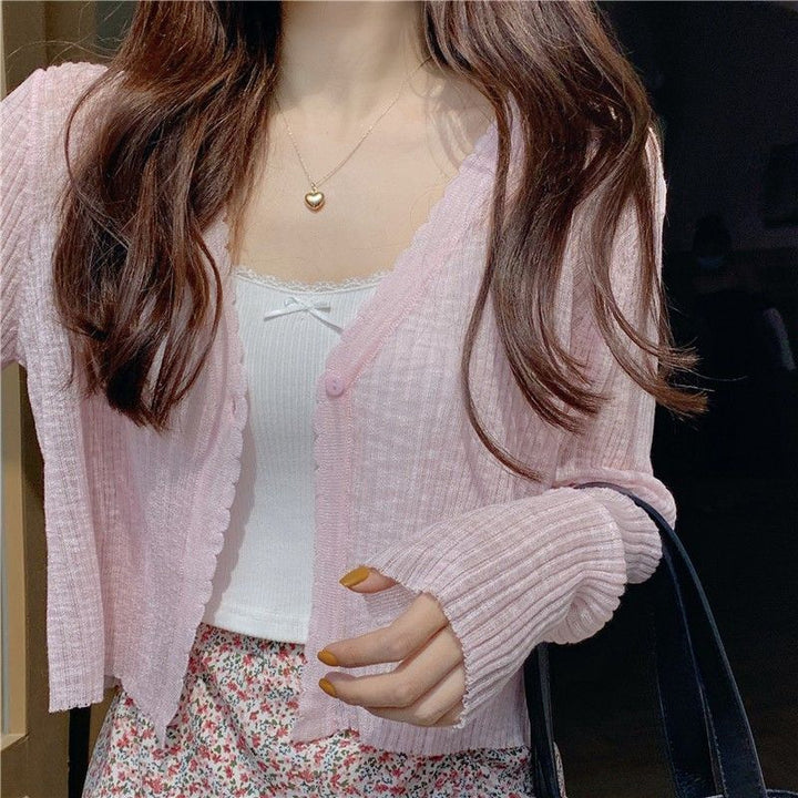 Women's casual cardigan with decorative button design and ribbed finishes