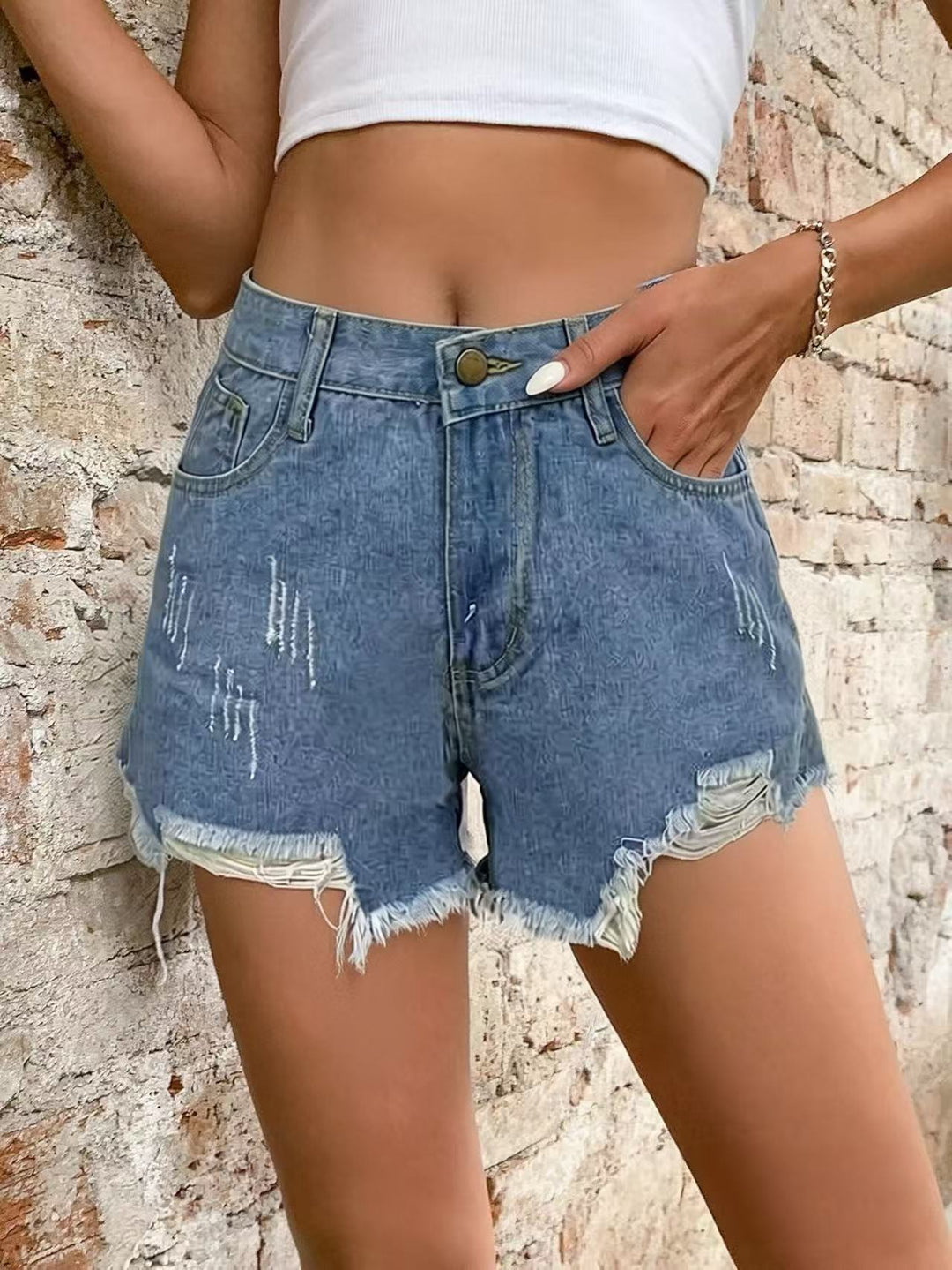 Women's fashionable destroyed denim shorts with frayed hem Lune London