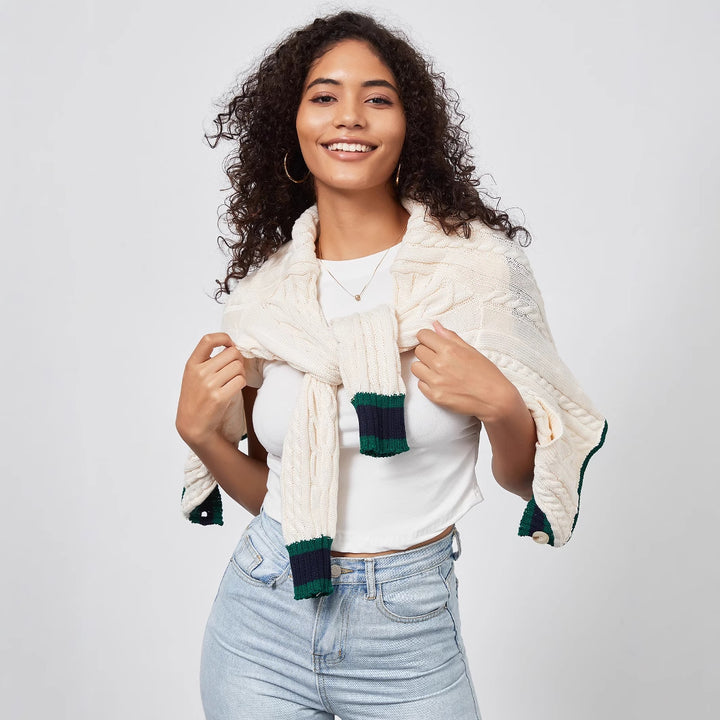 Chunky knit cardigan for women with decorative button placket and matching hem.