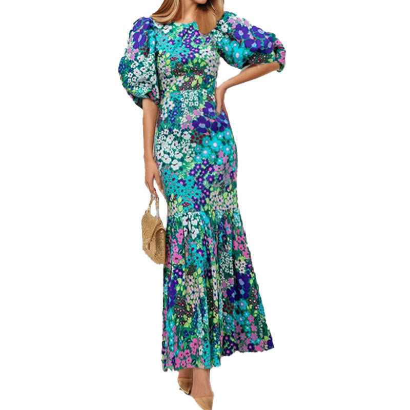 Robe maxi pour femmes avec des manches bouffantes volumineuses et des motifs floraux Chic & Stil