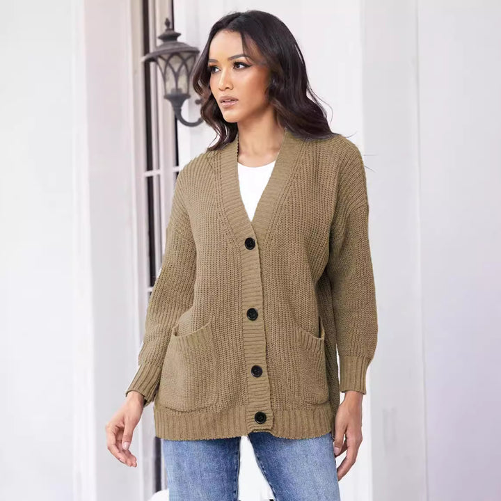 Fashionable knitted jacket for women with button closure all the way down and large pockets Lune London