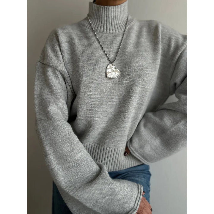 Pull en maille épaisse pour femme avec col montant et manches volumineuses Chic & Stil