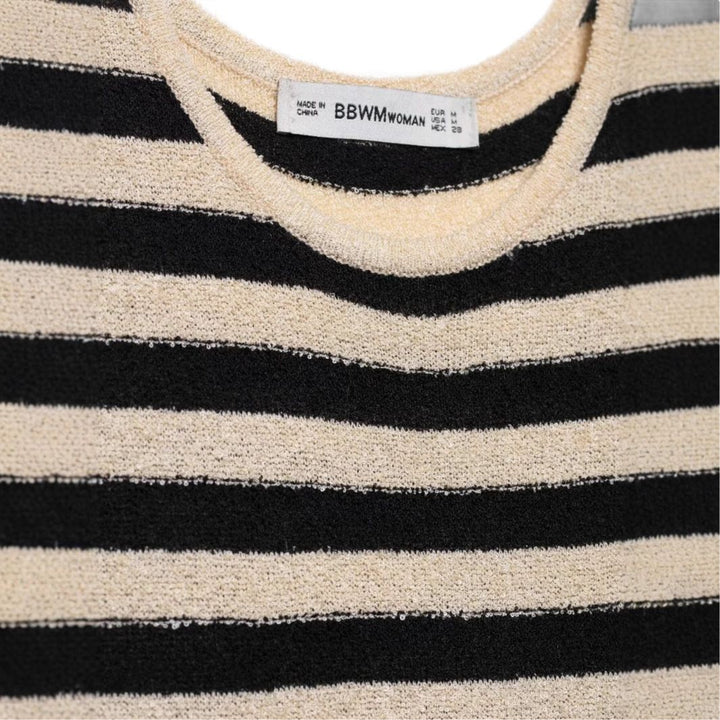 Maxi dress for women with an asymmetrical stripe pattern and elegant ruffle trim Lune London