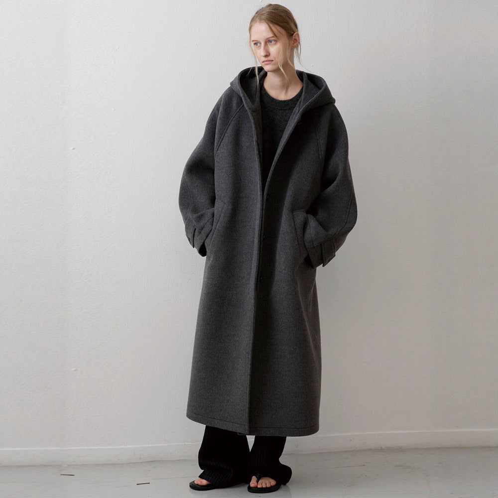 Manteau surdimensionné élégant pour femmes avec capuche et poches pratiques Chic & Stil