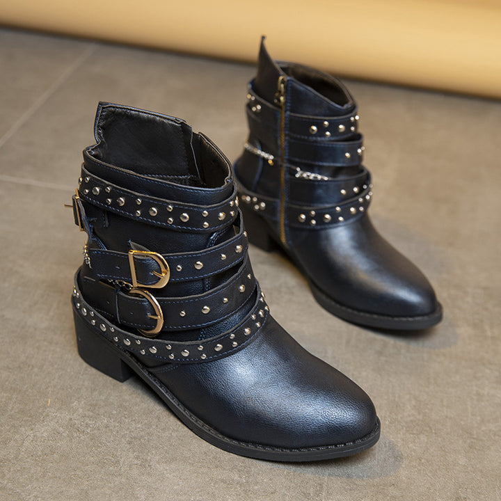 Trendy women's ankle boots with decorative straps and chain elements Lune London
