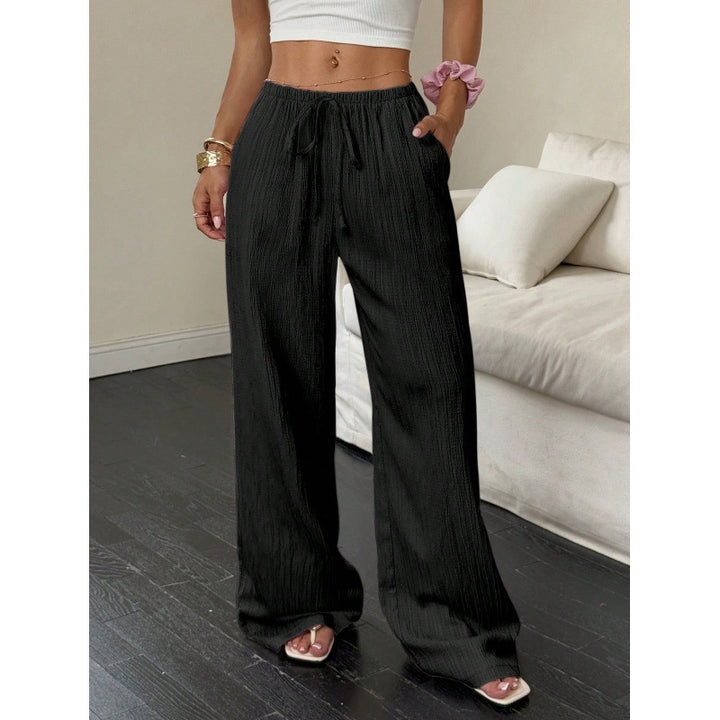 Casual and wide trousers for women with elastic waist and tie belt Lune London