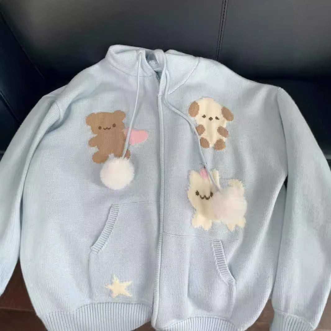 Hooded jacket for ladies with playful animal patterns and pom poms Lune London