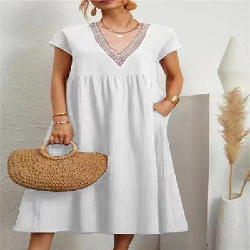 Robe maxi femme avec un élégant décolleté en V et des poches latérales Chic & Stil