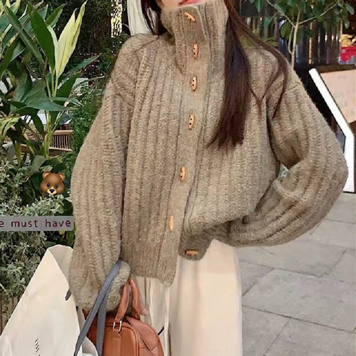 Cozy knitted sweater for women with a high collar and button details Lune London