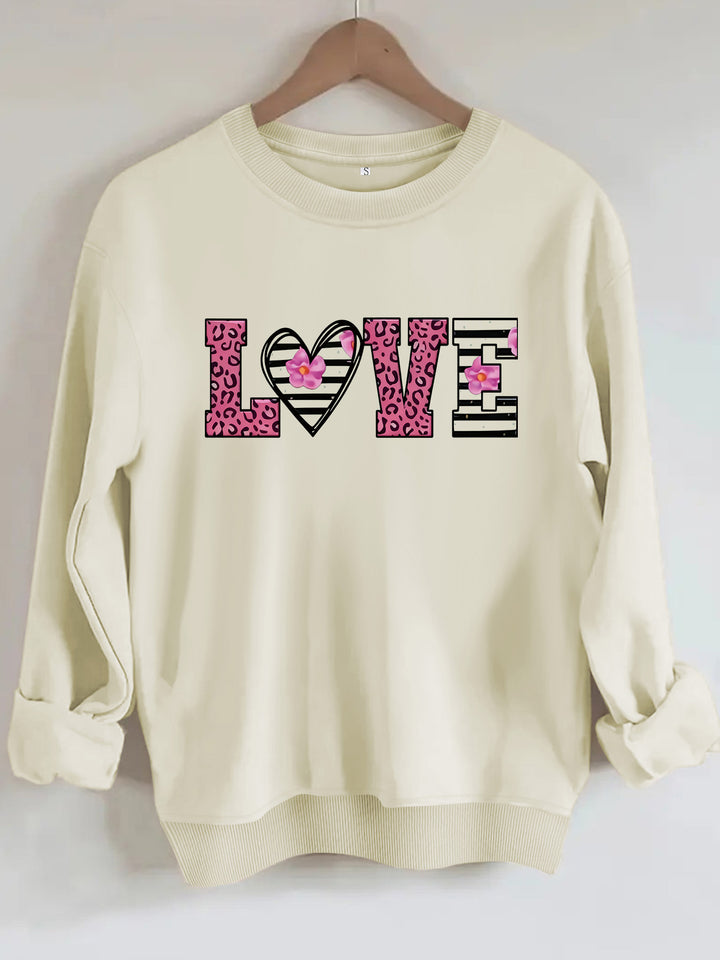 Sweatshirt femme avec design moderne de cœur léopard et coupe confortable Chic & Stil