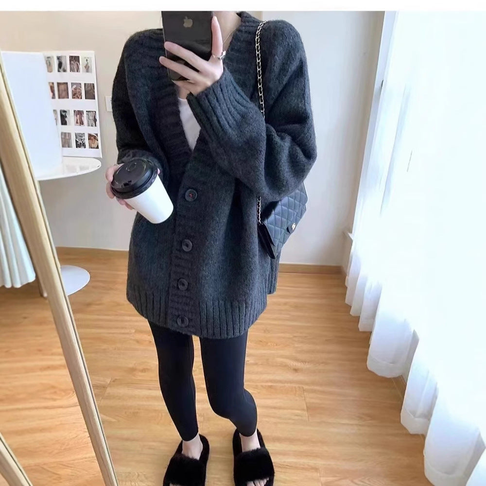 Oversized knitted jacket for women with a deep V-neck and button details Lune London