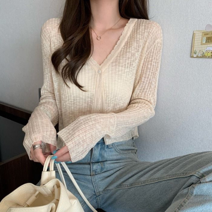Women's casual cardigan with decorative button design and ribbed finishes