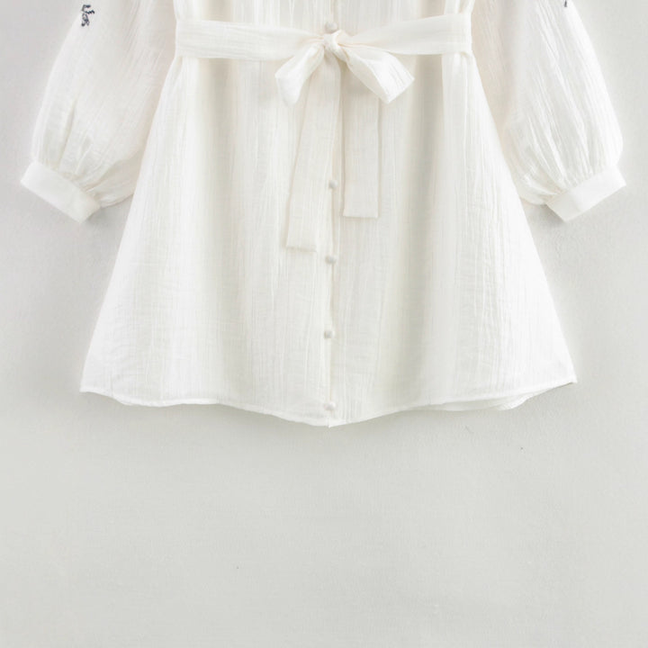 Elegant women's blouse with floral embroidery detail Lune London