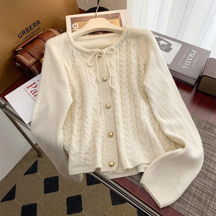Women’s knitted jacket with embossed pattern and decorative button details Lune London