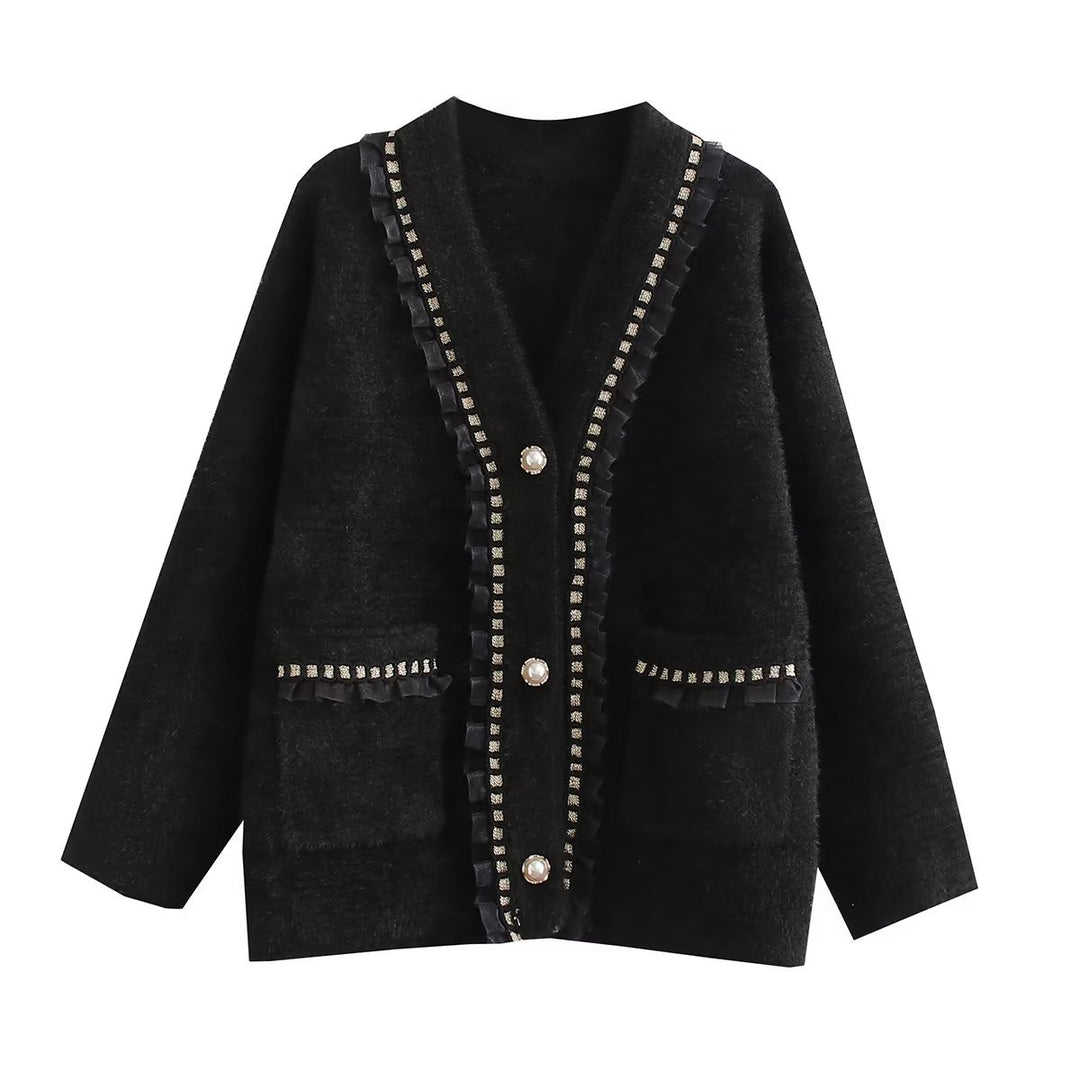 Fashionable women's knitted jacket with decorative ruffles and button details adorned with pearls Lune London