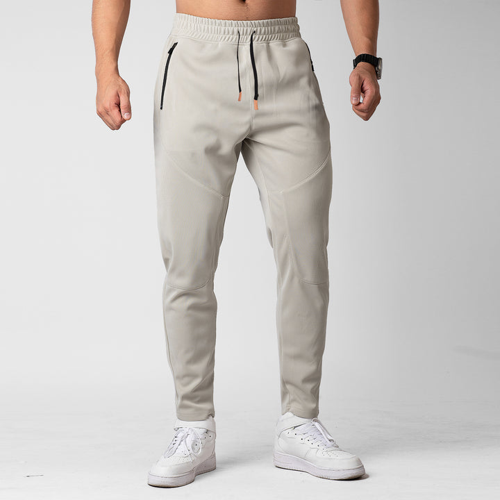 Men's sporty jogging pants with an innovative breathable structure and practical zippered pockets Lune London