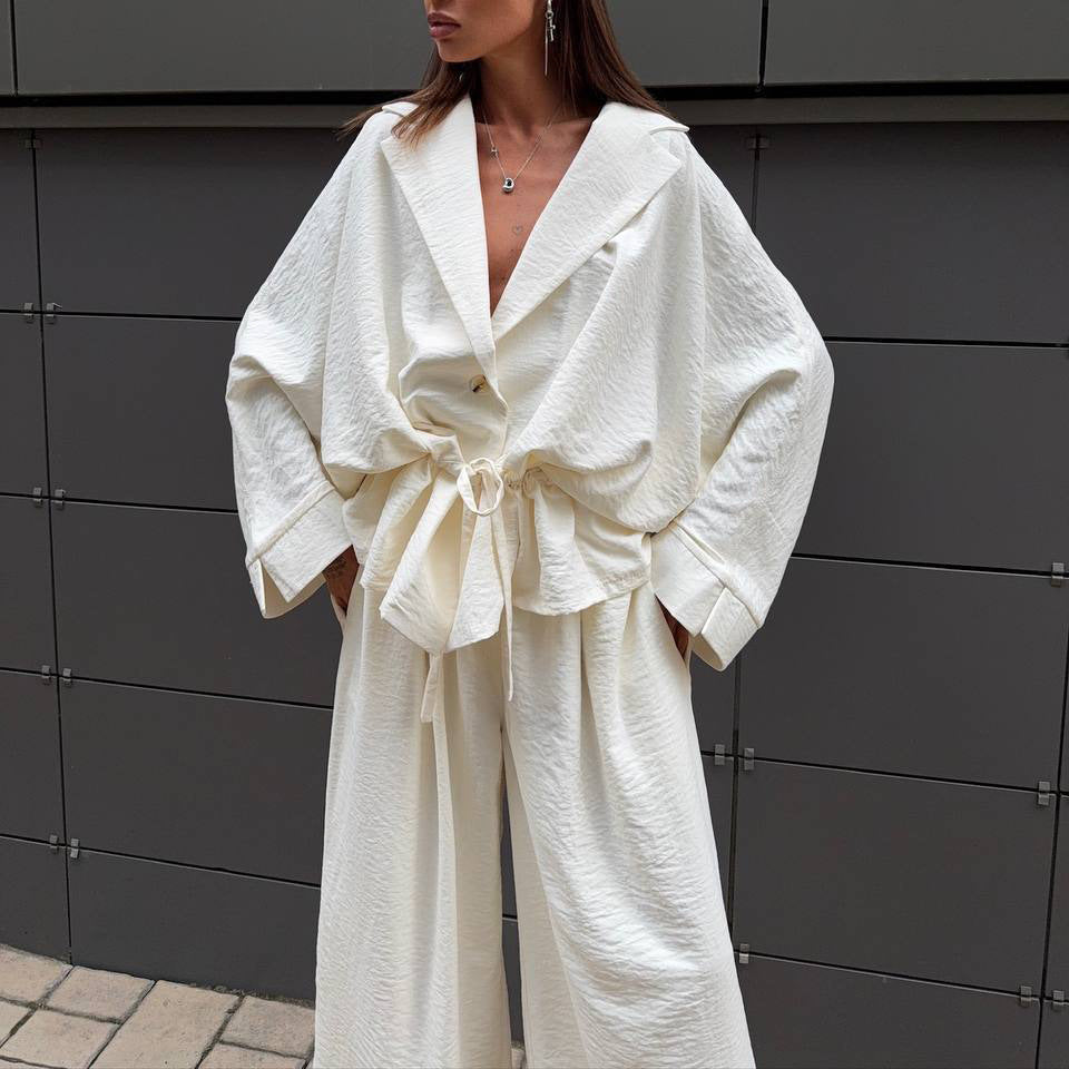 Trendy women's jumpsuit with a wide cut and cinched belt Lune London