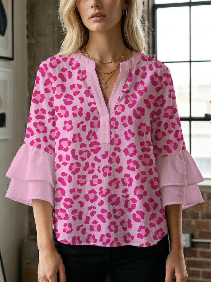 Women's blouse with ruffle details and eye-catching animal print Lune London