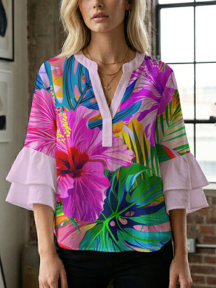 Women’s blouse with voluminous ruffled sleeves and floral pattern Lune London