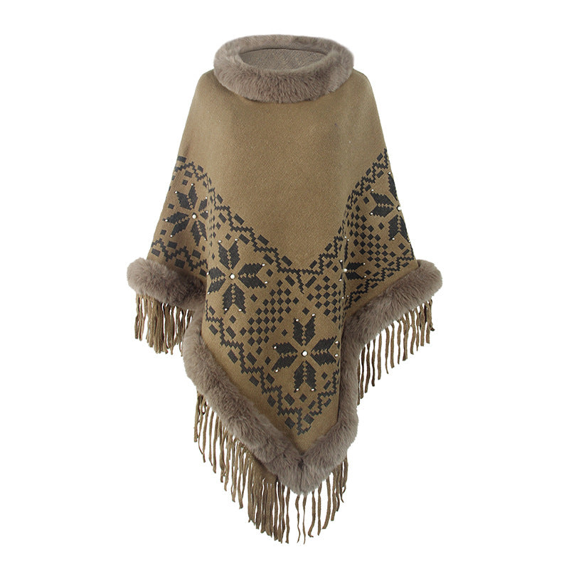 Elegant women's poncho with decorative fringe design and faux fur trim Lune London