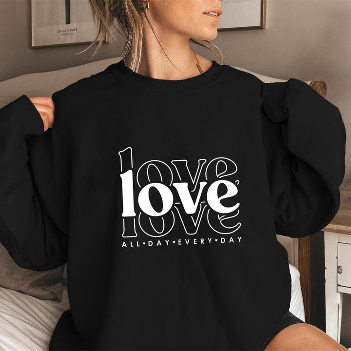 Sweat-shirt pour femmes avec des manches volumineuses et imprimé moderne "love" Chic & Stil
