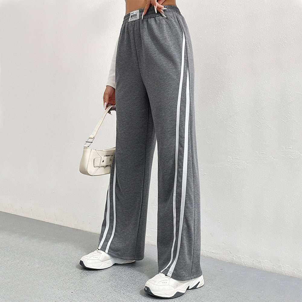 Pantalons de loisirs sportifs pour femmes avec coupe large et rayures contrastées Chic & Stil
