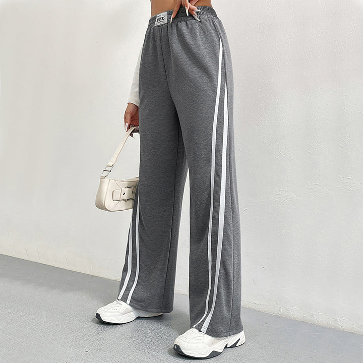 Pantalons de loisirs sportifs pour femmes avec coupe large et rayures contrastées Chic & Stil