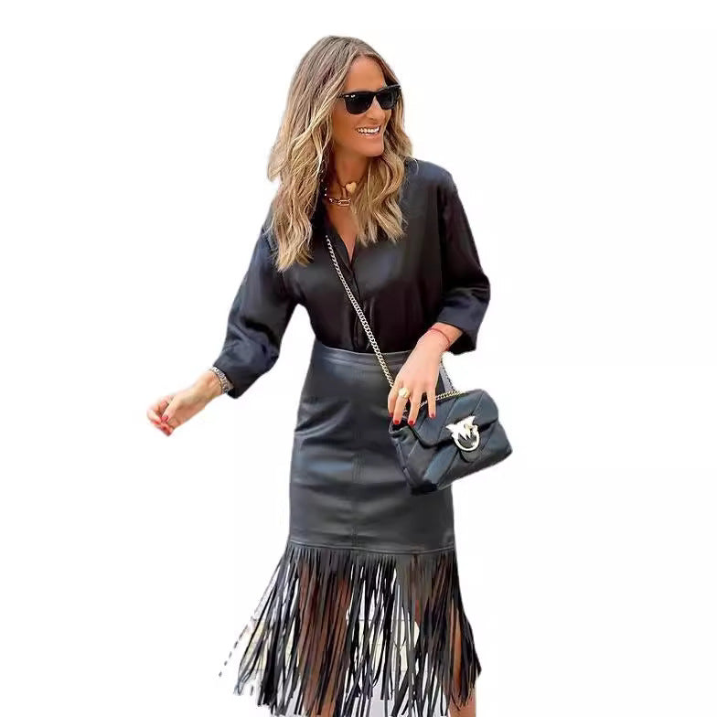 Women's fuchsia fringe skirt made of faux leather with a fitted silhouette and swinging design