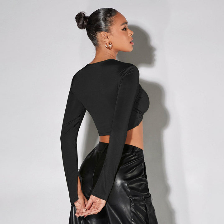Chic & Stil women's cropped top with sophisticated draped details and long sleeves