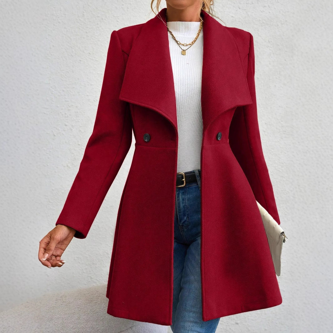 Ladies elegant wool coat with a loose and cinched silhouette and modern button details Lune London