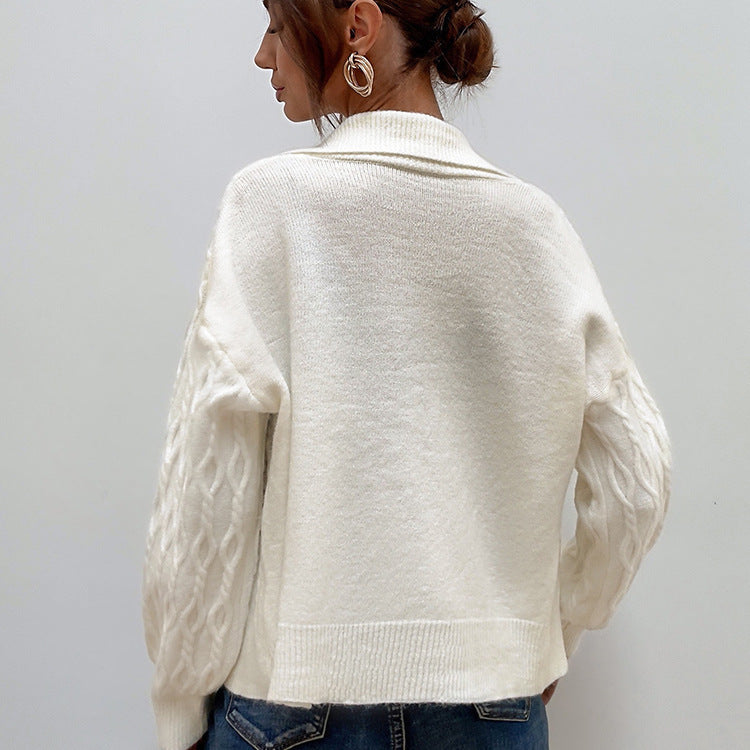 Ladies chunky sweater with an elegant cable knit pattern and chic pearl buttons
