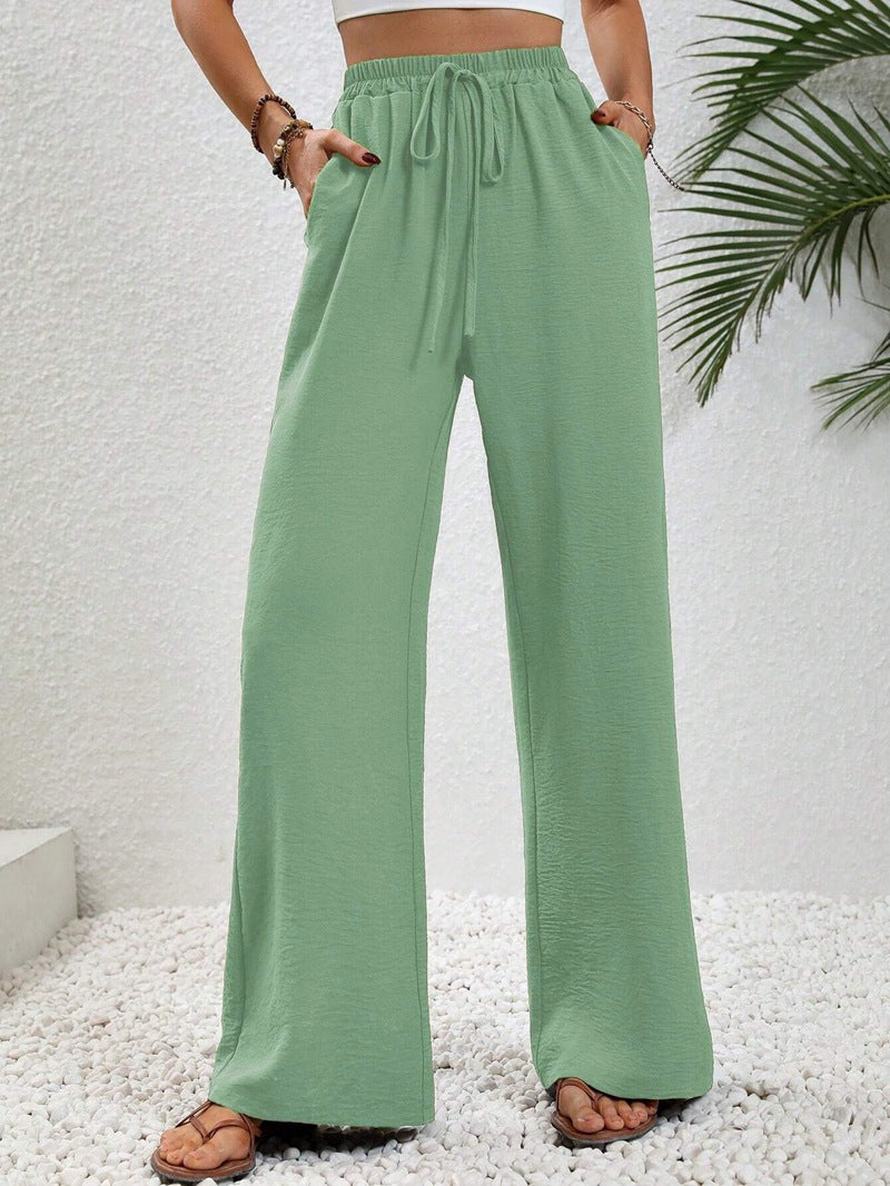Pantalons larges d'été pour femmes avec taille élastique et poches latérales pratiques Chic & Stil