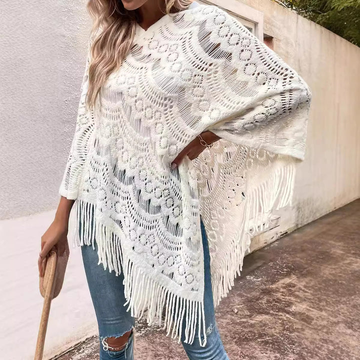 Ladies knitted poncho with chic and stylish fringed design