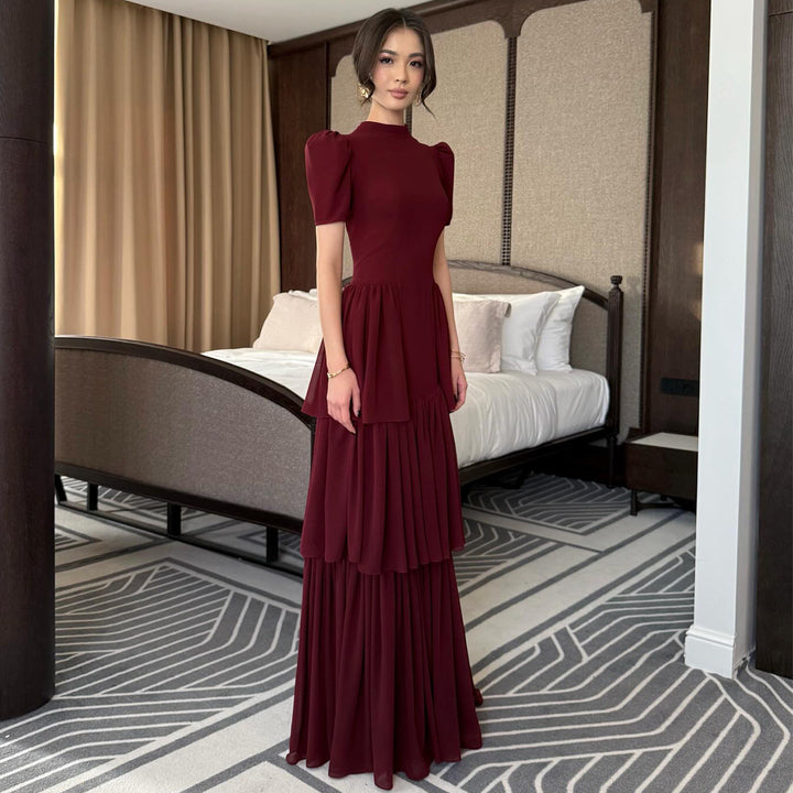 Women's maxi dress with voluminous ruffle details and elegant cut