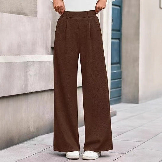 Loose fabric trousers for women with high waist and practical pockets. Chic and style