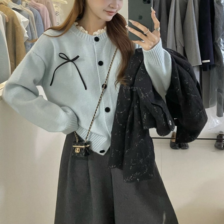 Knit cardigan for women with decorative buttons and a bow accent Lune London