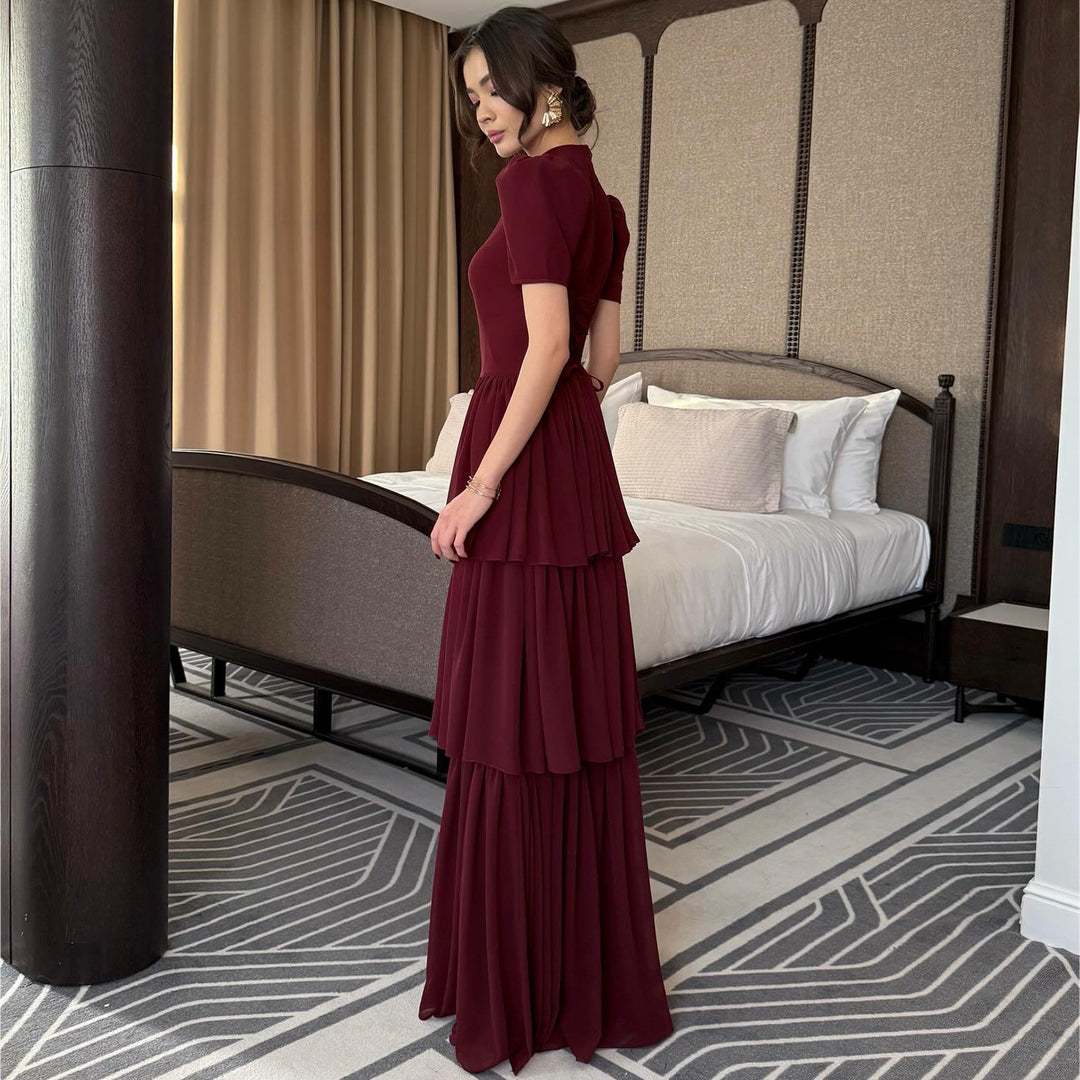 Women's maxi dress with voluminous ruffle details and elegant cut