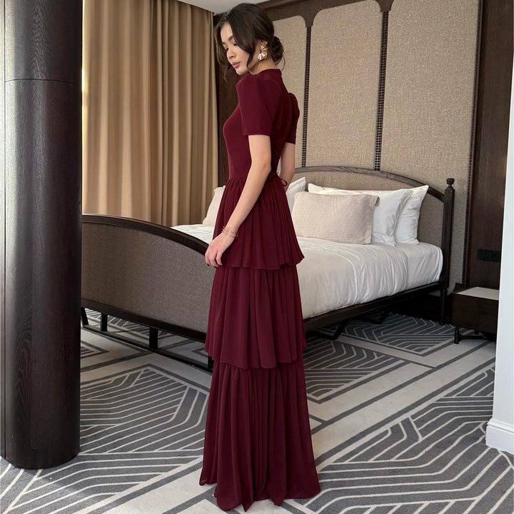 Women's maxi dress with voluminous ruffle details and elegant cut