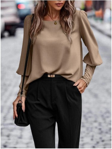 Elegant women's blouse with puff sleeve details and structured fabric Lune London