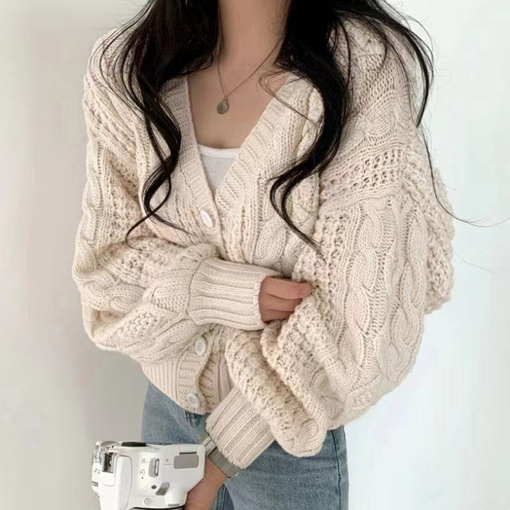 Thick knitted jacket for women with voluminous sleeves and a unique cable pattern Lune London