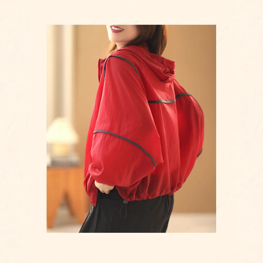 Women's lightweight hoodie jacket with elastic hem and reflective details Chic & Stil