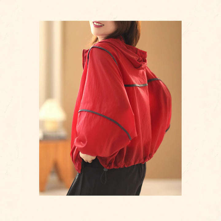 Women's lightweight hoodie jacket with elastic hem and reflective details Chic & Stil