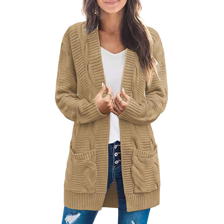 Ladies chunky knit cardigan with elegant cable patterns and practical pockets Lune London