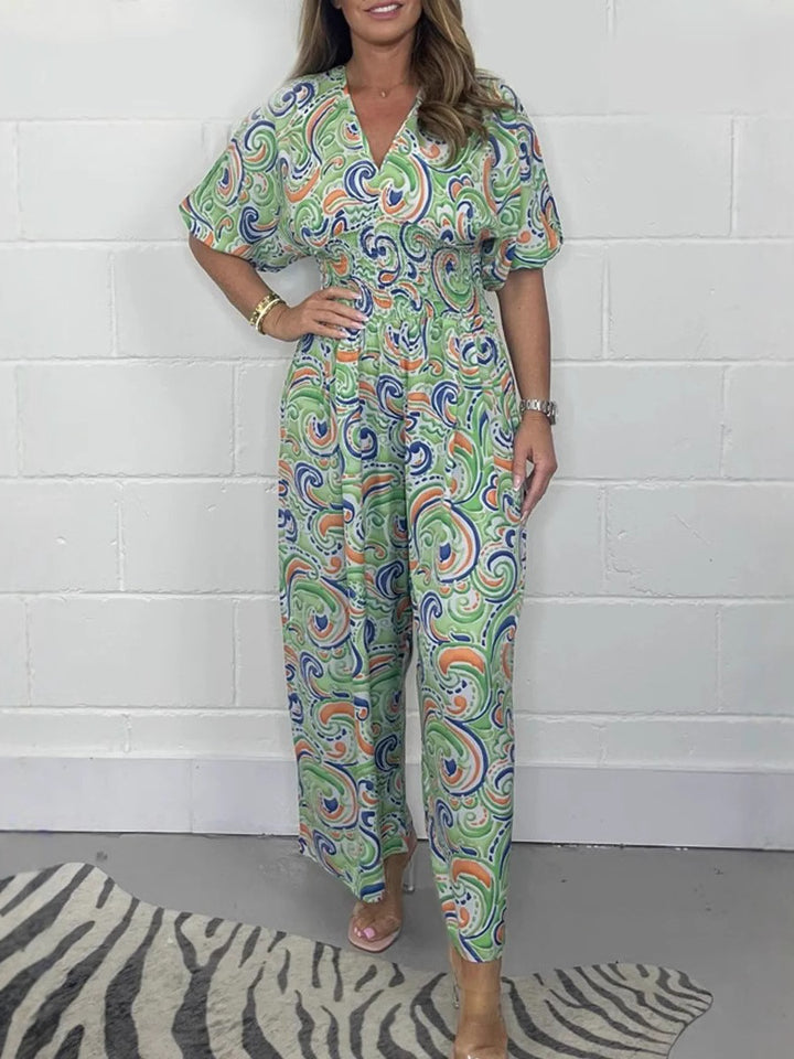 Lady Fluid jumpsuit with elegant paisley pattern and Lune London cinching