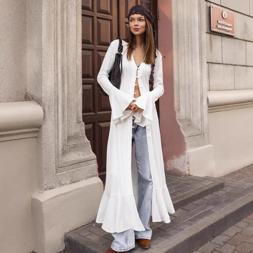 Long knitted coat for women with an elegant cut and a chic button design.
