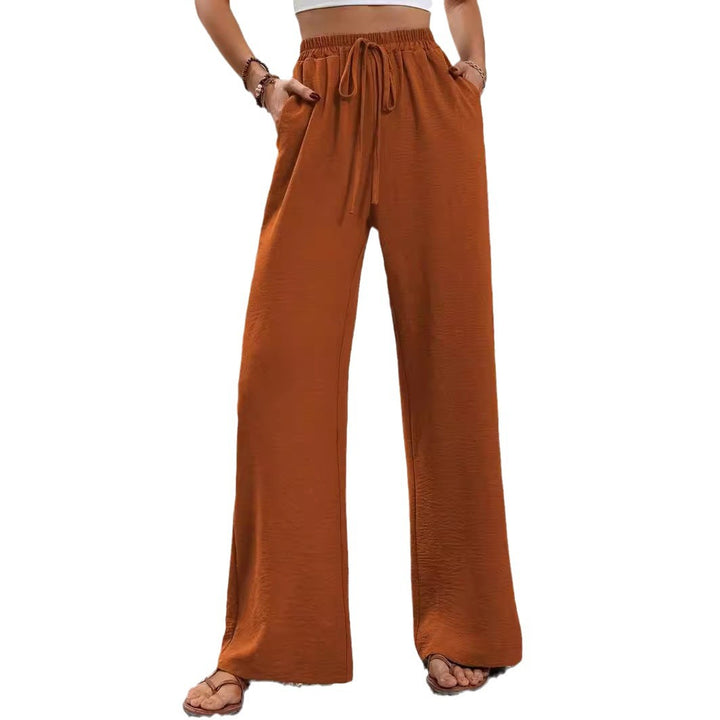 Pantalons larges d'été pour femmes avec taille élastique et poches latérales pratiques Chic & Stil