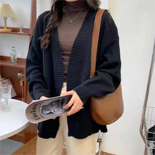 Ladies chunky knit cardigan with a loose fit and long sleeves Lune London