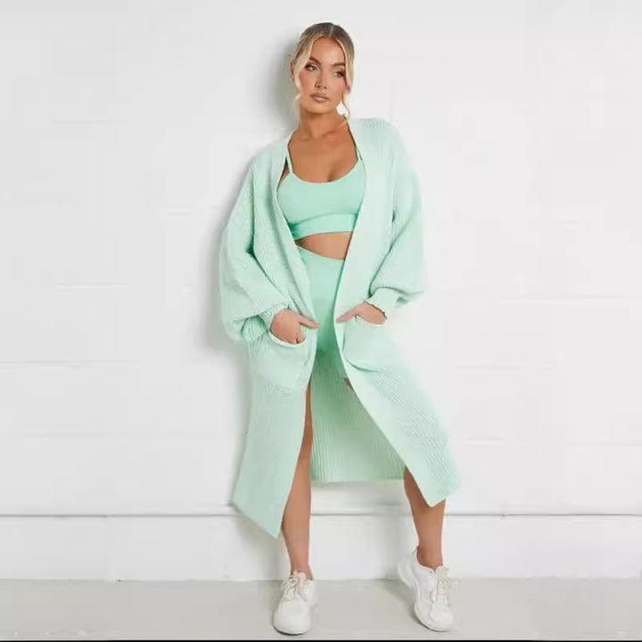 Ladies long cardigan with a chunky knit structure and practical pockets Lune London