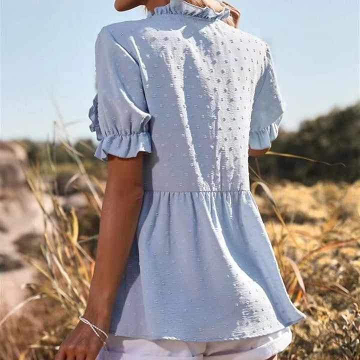 Elegant summer top for women with ruffle details and chic V-neck style
