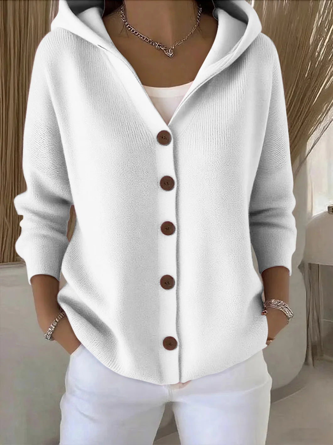 Knitted hooded jacket for ladies with practical button details and a relaxed fit Lune London